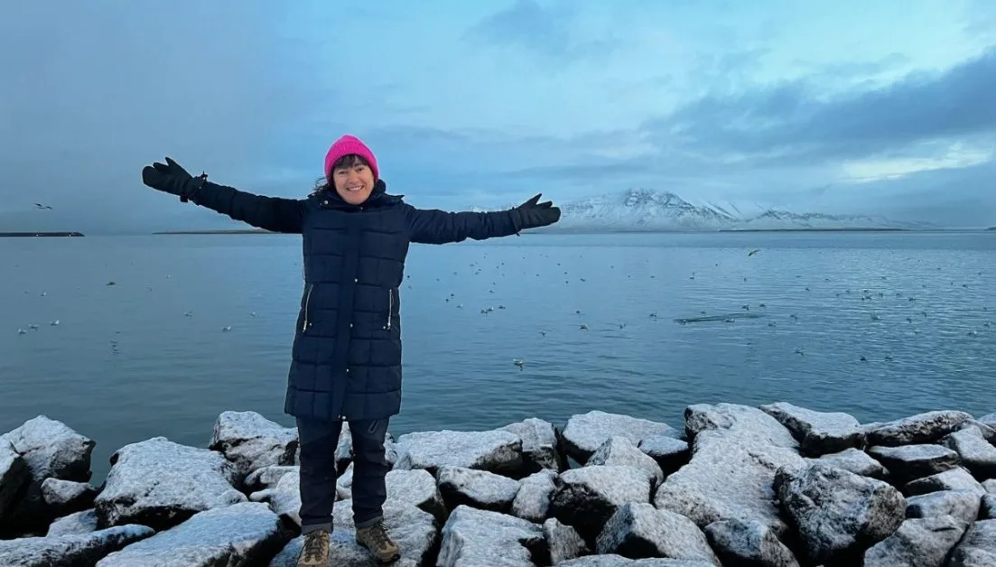 Woman enjoying walk around Reykjavik harbour.