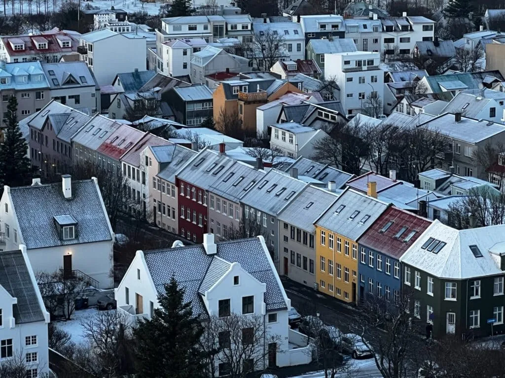Colored homes in Reykjavik with ice covered roofs.