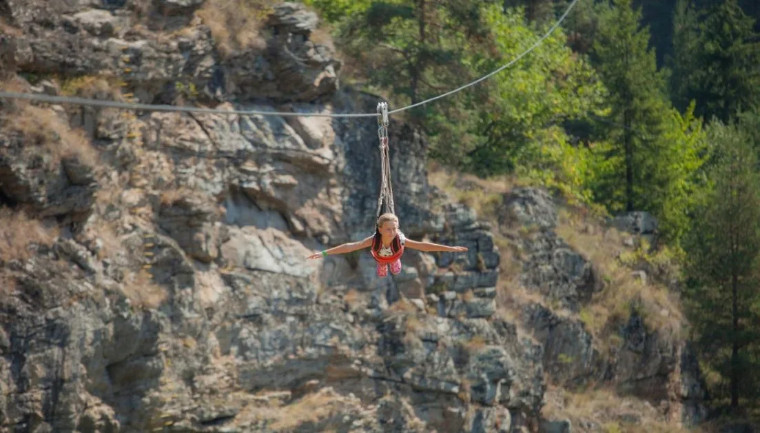 Zip line in Leadville over valleys and with views of the Rocky Mountains.