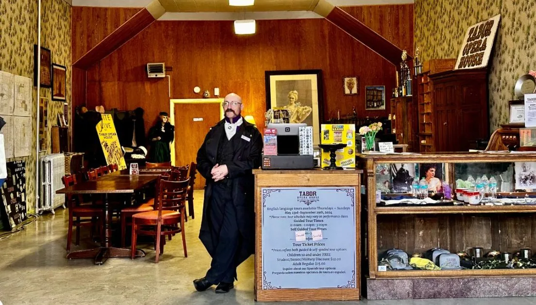 Entrance to Tabor Opera Visitor Center with guide waiting for visitors.