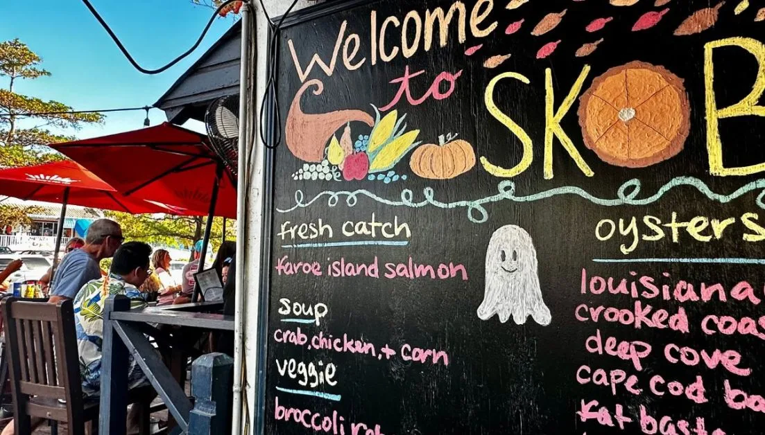 Menu and drinks boards at SKOB restaurant in Siesta Key Village. For decades people agree this is one of the best things to do in Sarasota to relax during happy hour.