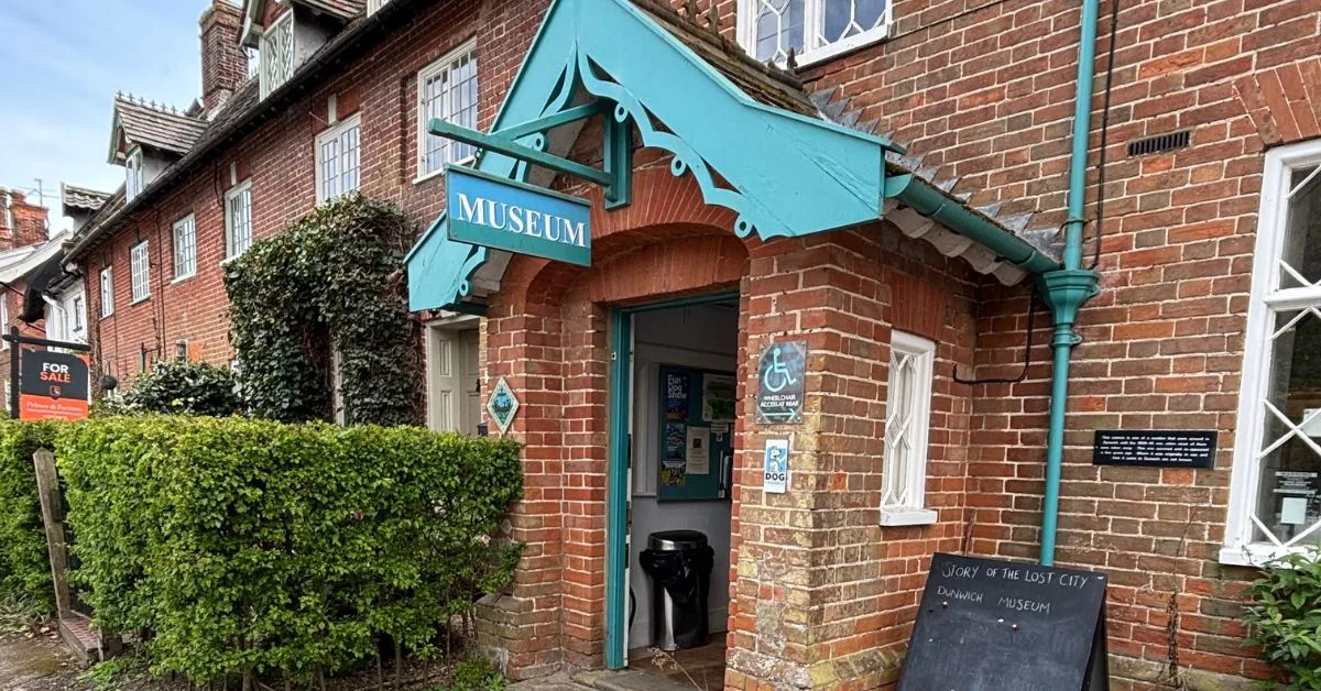 Entrance to Dunwich Museum - porch style and a red brick building which looks like a house
