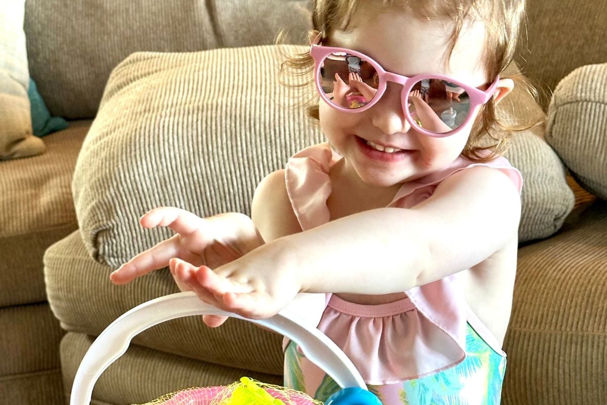 Toddler girl playing with toys in Kauai Hawaii