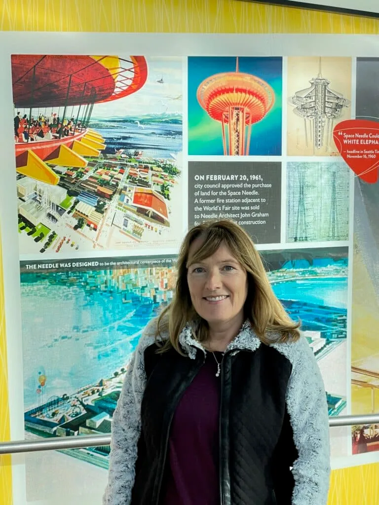 Woman waiting to take the elevator to the top of the Space needle in Seattle.