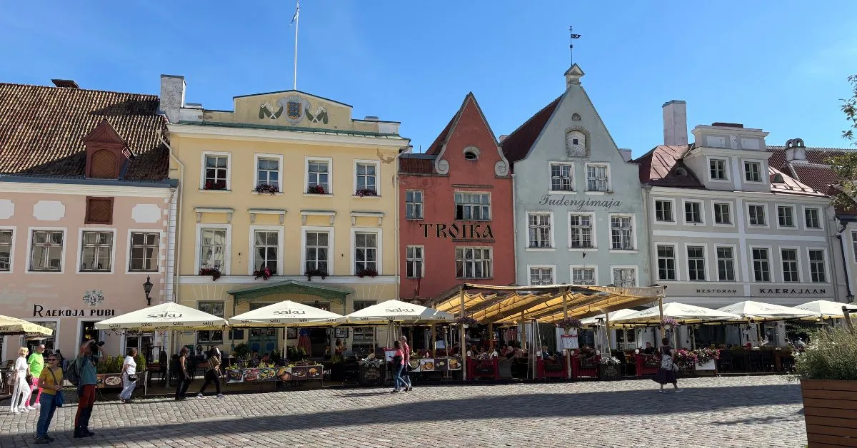 Colourful row of merchant buildings in Town Square with outdoor pavement cafes