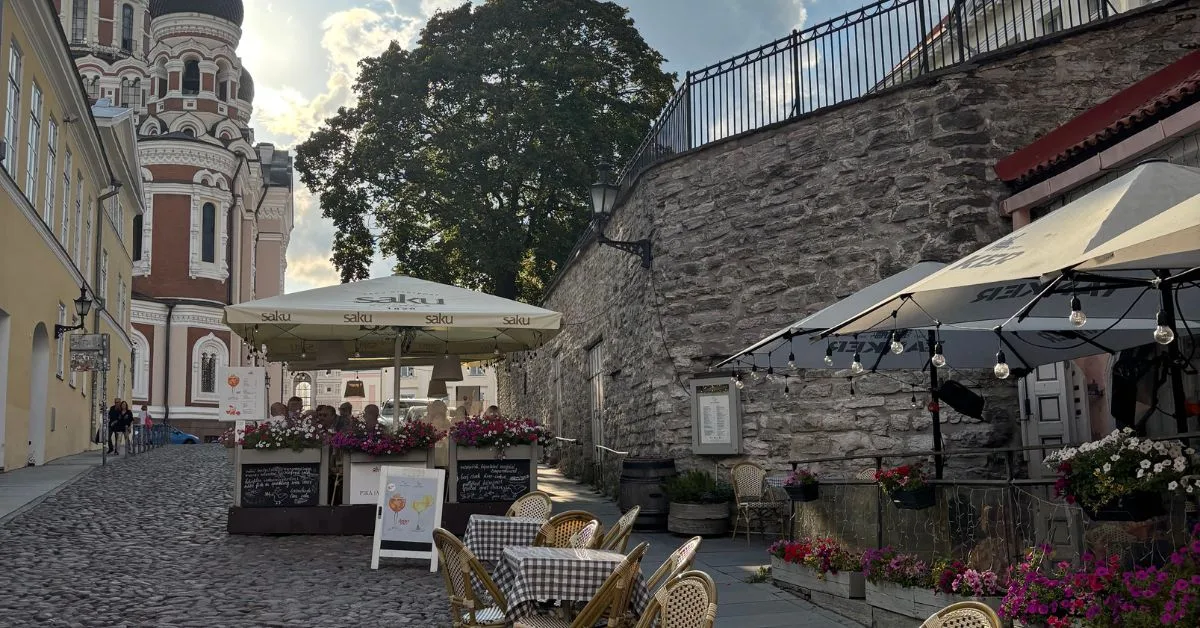 Side street cafe with church in the background