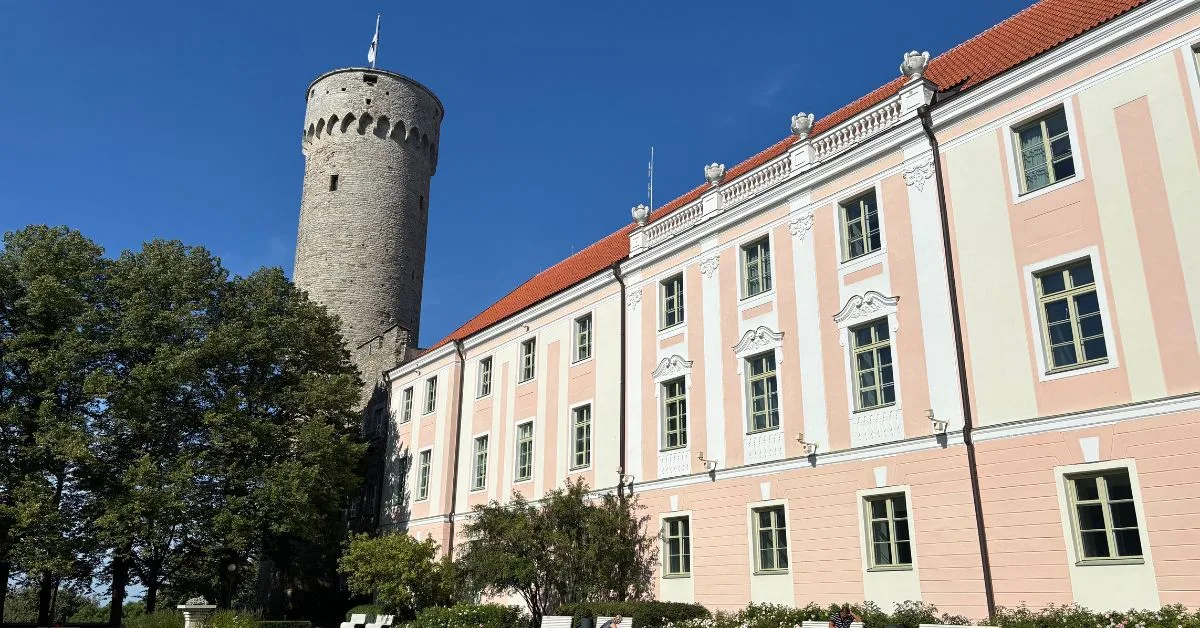 Pink Governmental building with tall tower of Pike Herman part of Toompea Castle also in this image