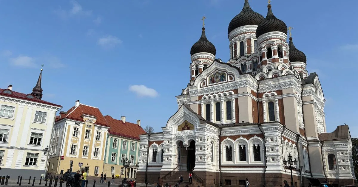 Russian orthodox in style Alexander church with its onion domes - very large building of white, brown and creams