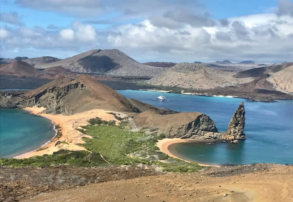 A landscape in the Galapagos Island showing volcanic peaks.