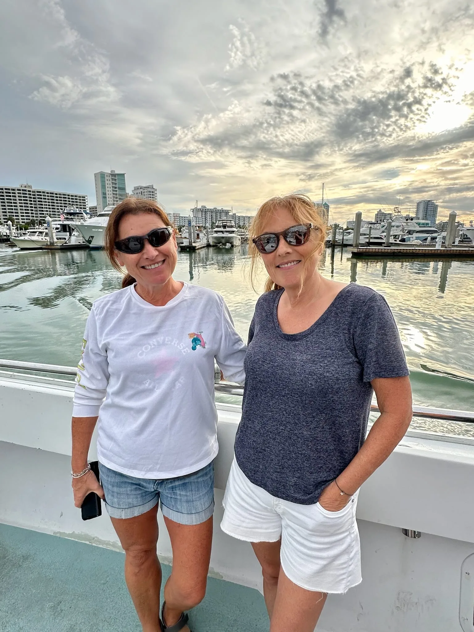 Two women at a marina waterfront