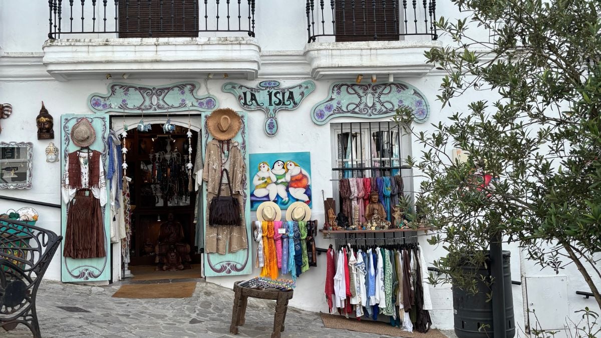 Clothing boutique storefront in Vejer de la Frontera's old town lanes