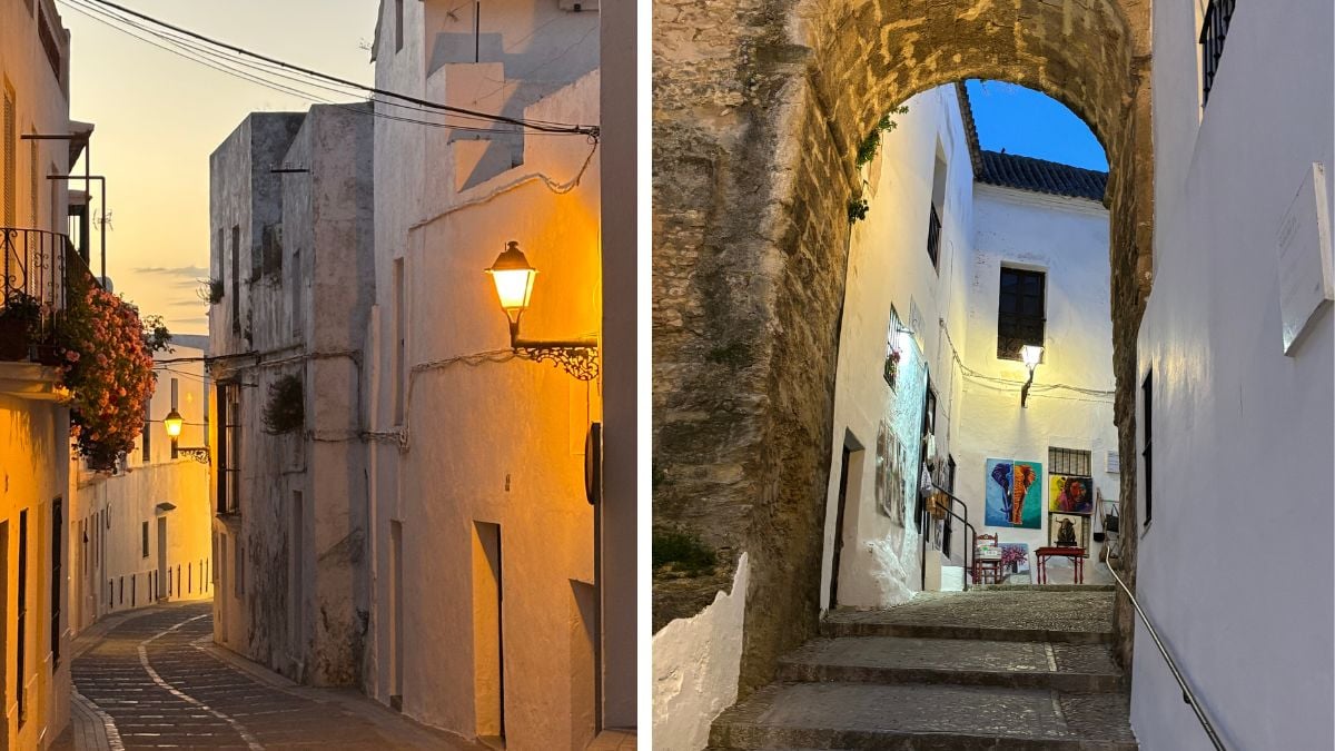 Vejer de la Frontera at night with warmly lit whitewashed streets and arched architecture