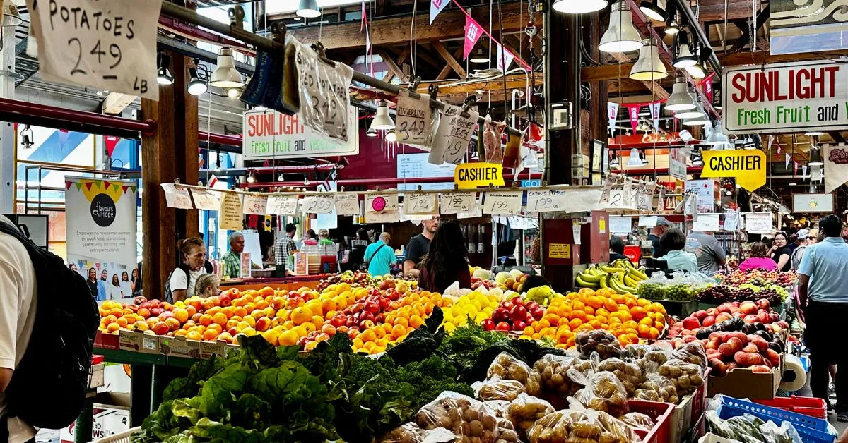 Fresh fruits and vegetables displayed in Granville Island Public Market.