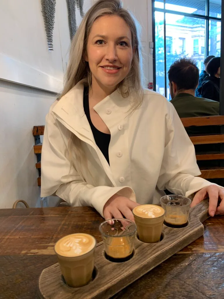 Woman ready to sample 4 different types of coffee.