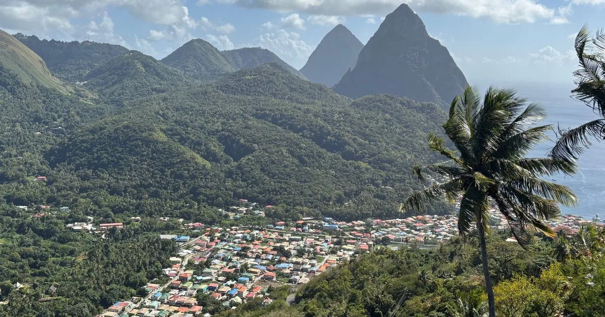Tiny Colourful rooftops of Soufriere with huge volcanic peaks and rolling hills in the background