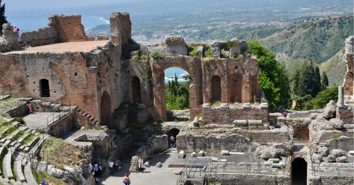 Ruins of a Roman Amphitheatre in Taormina Sicily overlooking the ocean.