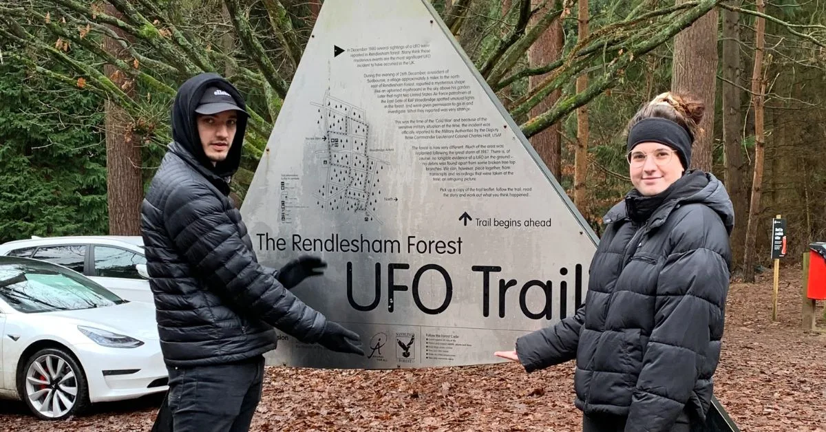 2 Visitors exploring the UFO map before hiking in Rendlesham Forest.