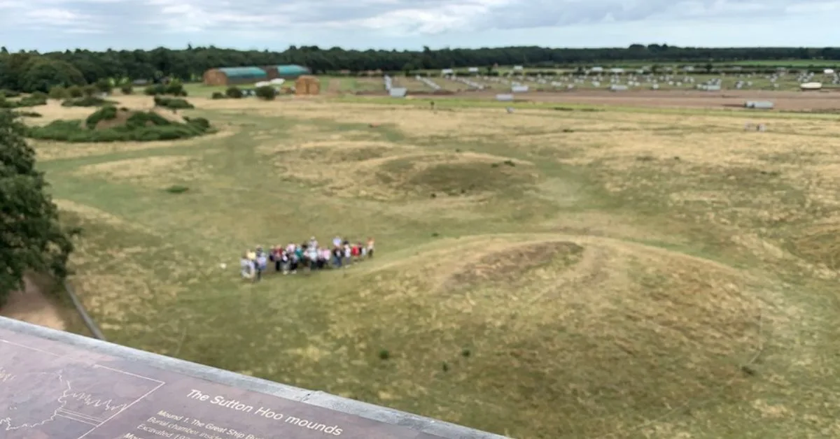 View over Sutton Hoo grass covered Mounds which is where an ancient longboat was discovered. This view is from a raised platform open to visitors.
