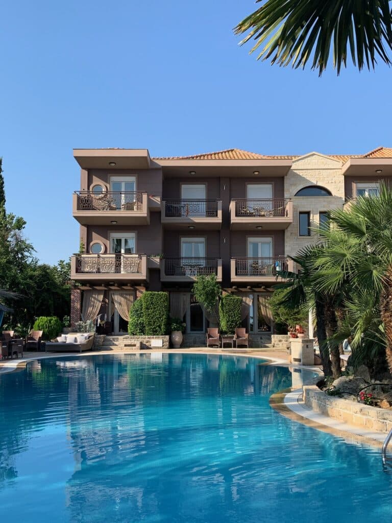 Hotel swimming pool with 3 story building