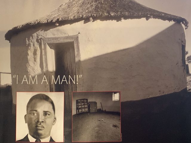Exhibit item with portrait of Nelson Mandela within the Capture Site Museum