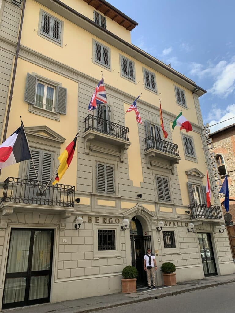 Official building with multiple flags in Florence Italy.