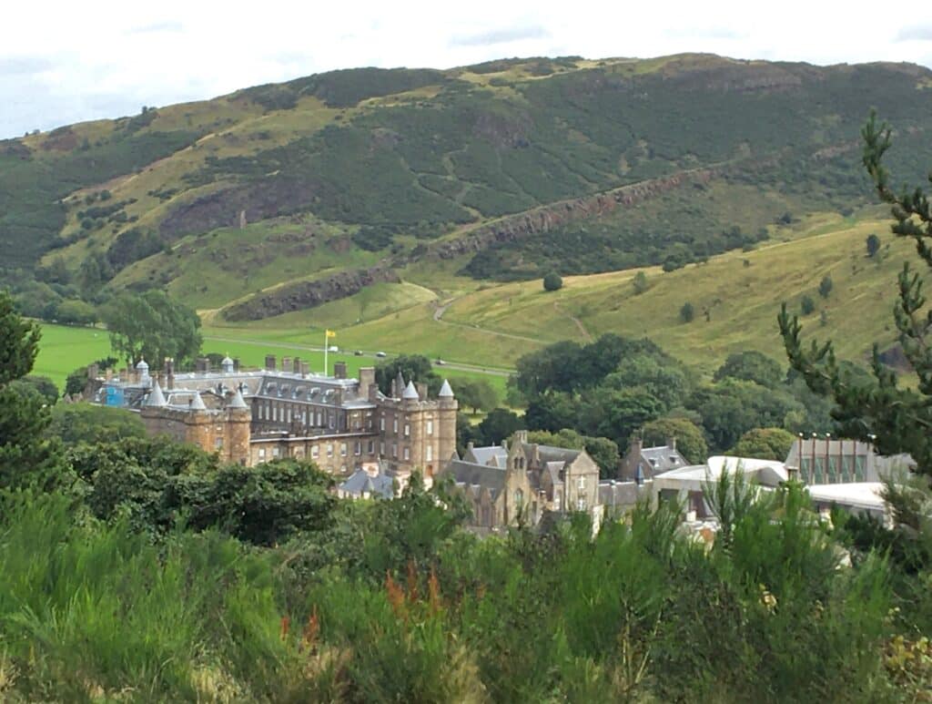 Hollyrood Palace is nestled amongst green spaces with trees and hills surrounding it although it is in the city centre of Edinburgh.