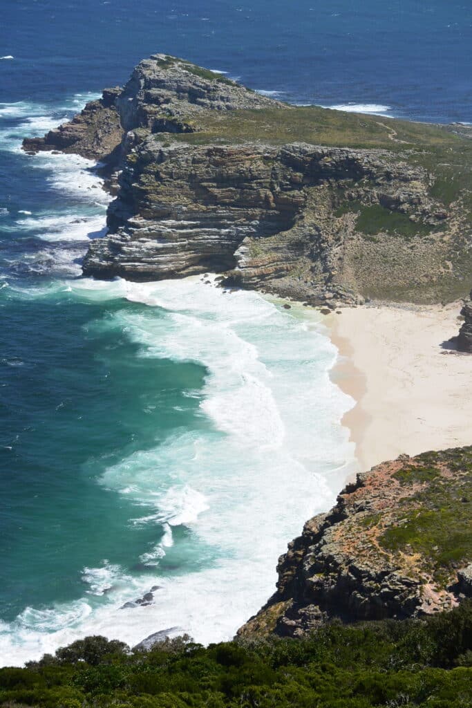 View of small beach and cove from a walk at Cape Point, South Africa.