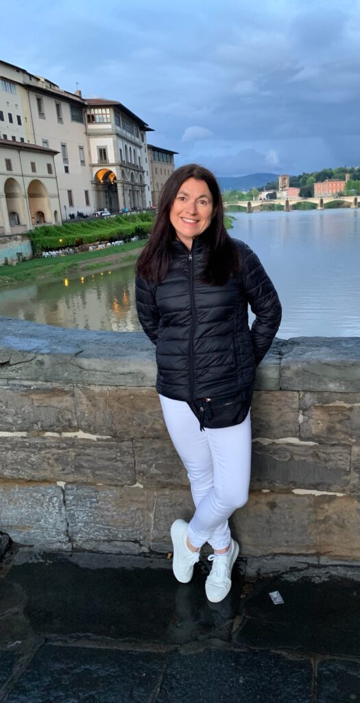 Tourist enjoying Florence and walking next to the river.