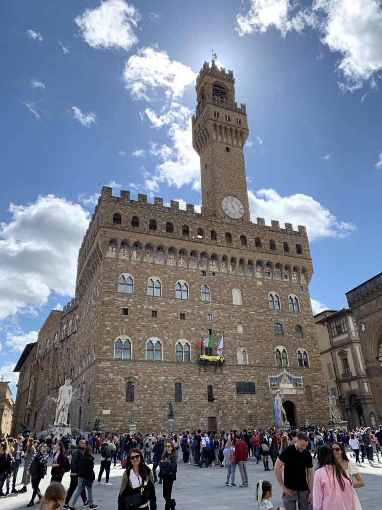 Tower in Siena with large ramparts.