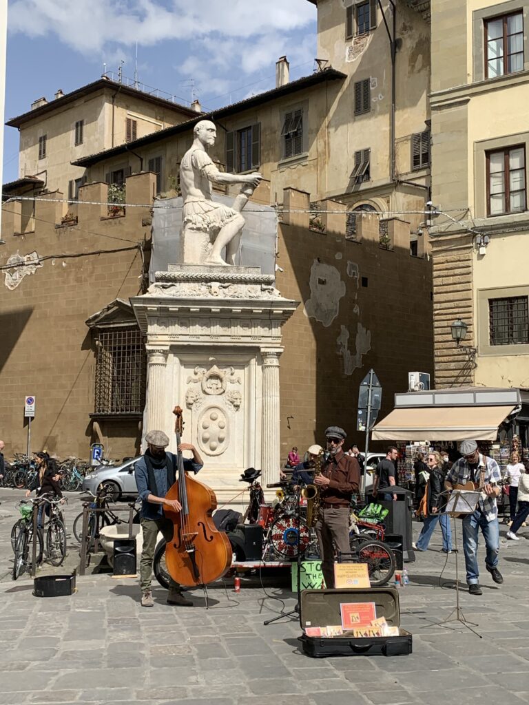 Musicians playing in a square.