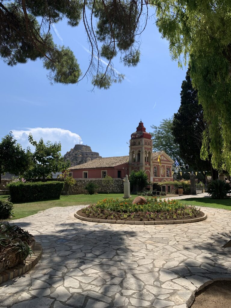 A garden scene with trees and shrubs.