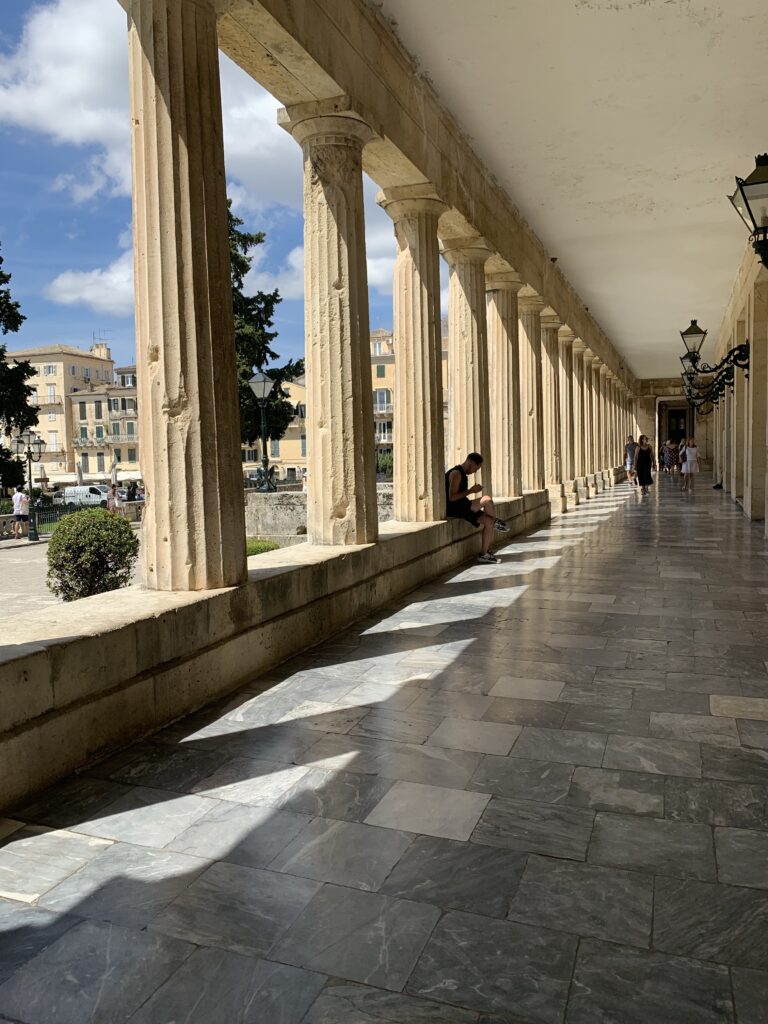 Pillars that are of Ancient Greece design are part of the entry way to a museum in Corfu Town.
