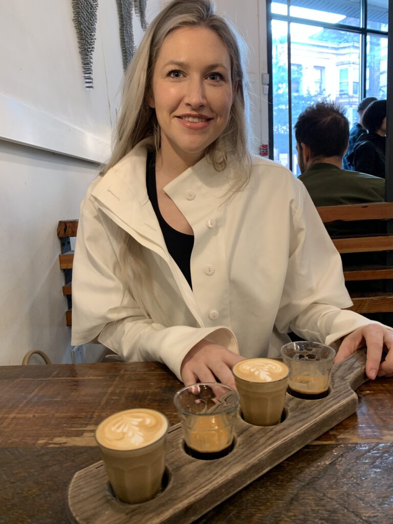 Woman ready to sample 4 different types of coffee.