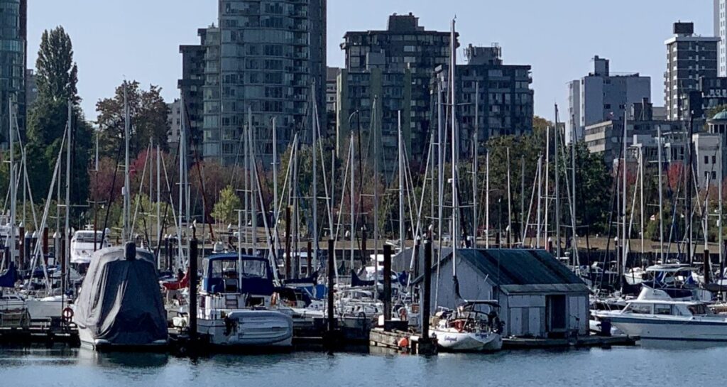 Vancouver has many high rises and almost as many boats tied up at the waterfront area next to the tall buildngs that are home for many locals.