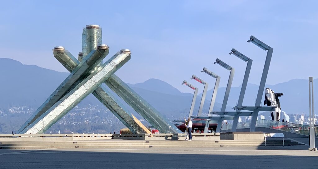 Industrial view with art installed near Canada Place. Large metal objects form a display.