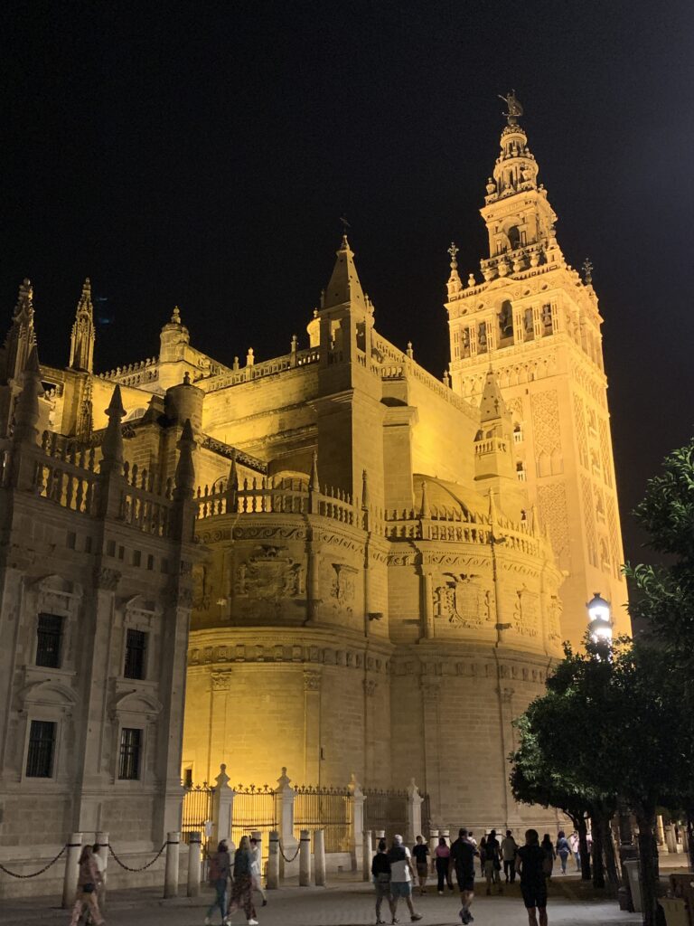 Building in Central Seville is lit up at night.