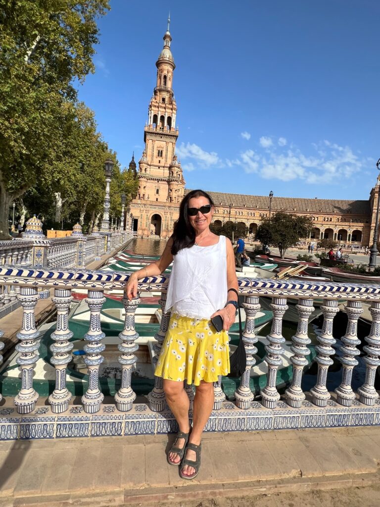 Woman in Plaza De Espana in Seville sightseeing.
