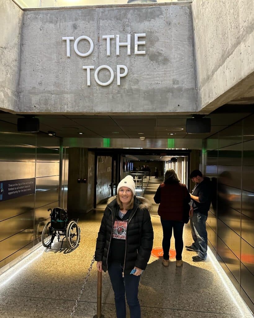 A tourist is waiting for the elevator to head to the top of the St Louis Arch.