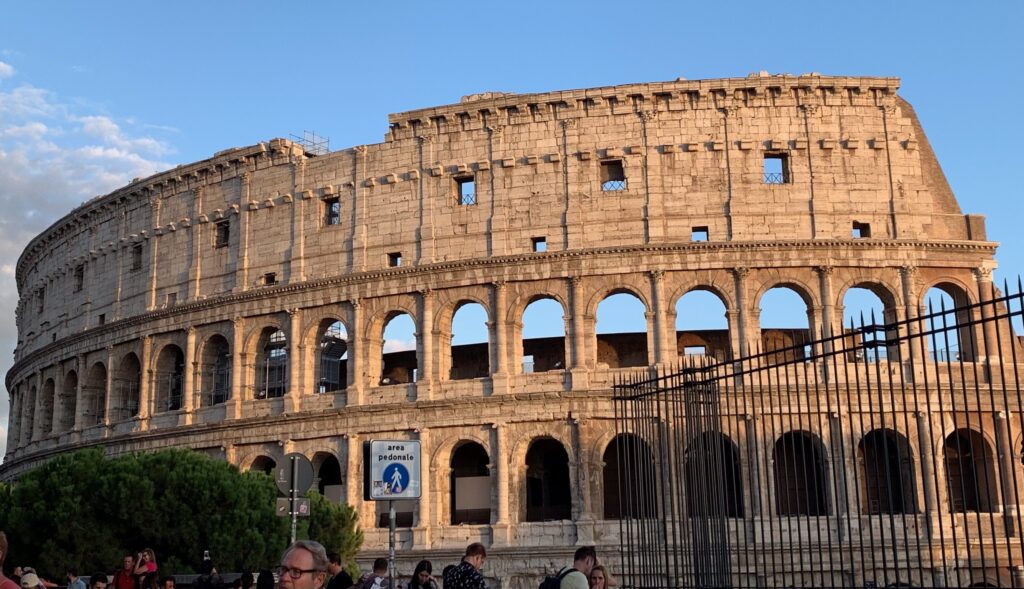 The ruins of the Colosseum in Rome Italy with ca urved circular design.