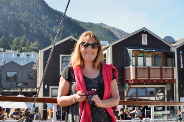 Woman standing next to the marina in Queenstown