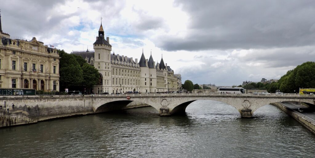 One of the many bridges that take you to the Latin Quarter of Paris. There are arches on this stone bridge.