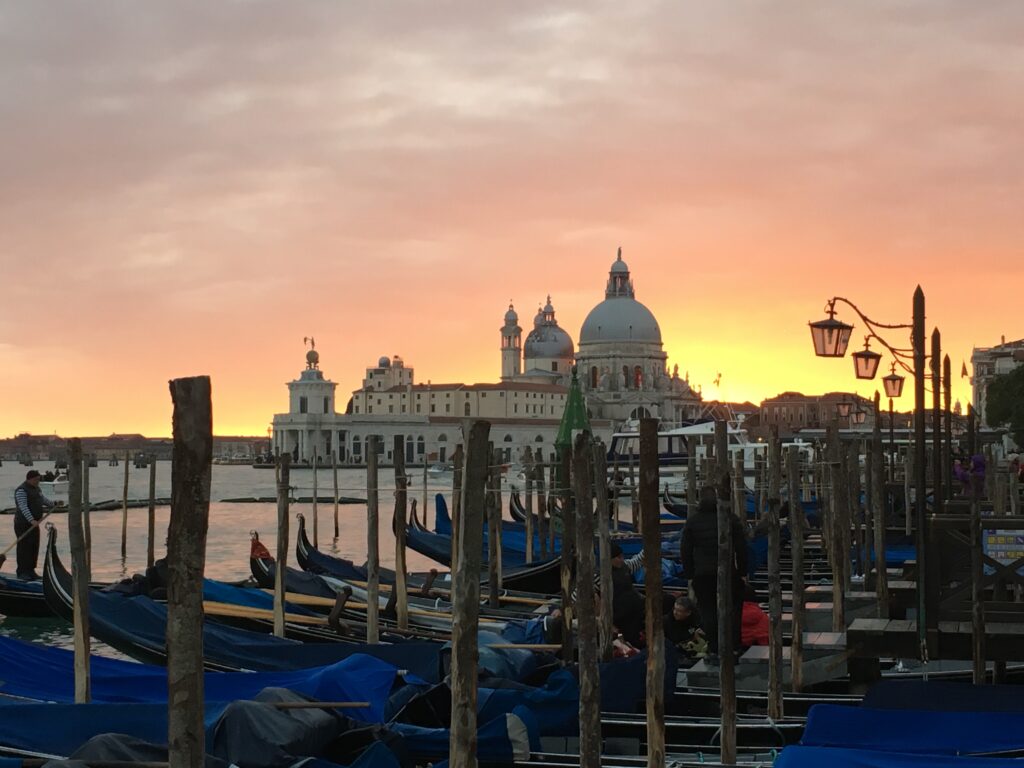 Sunset behind buildings in Venice. A great destination from October to December.