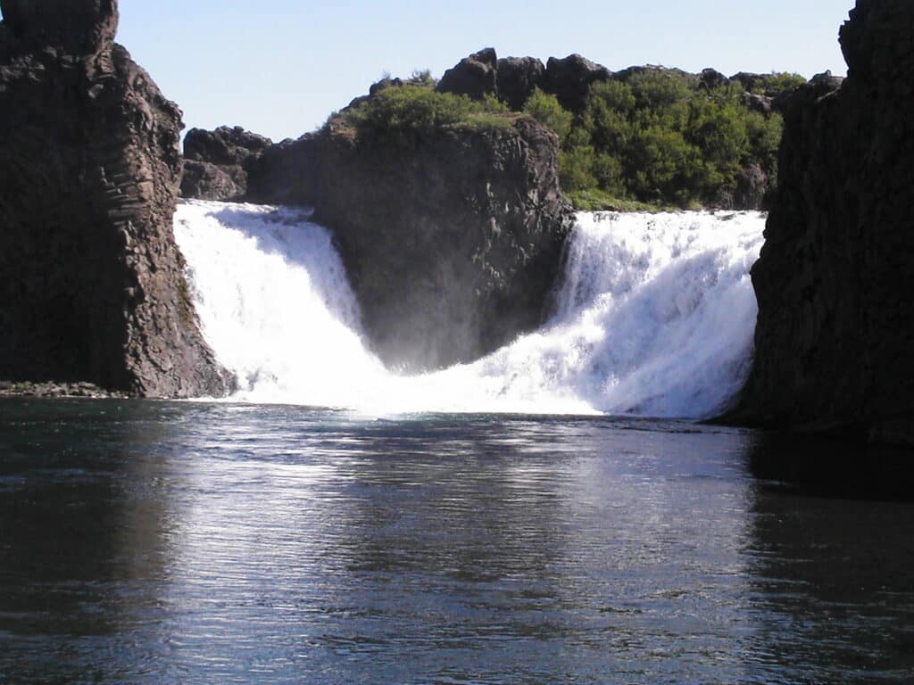 waterfalls flow into a lake in Iceland