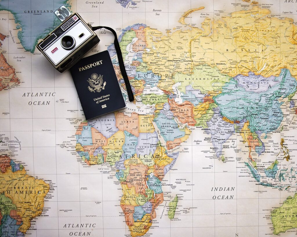 Map of the World with a camera and passport.