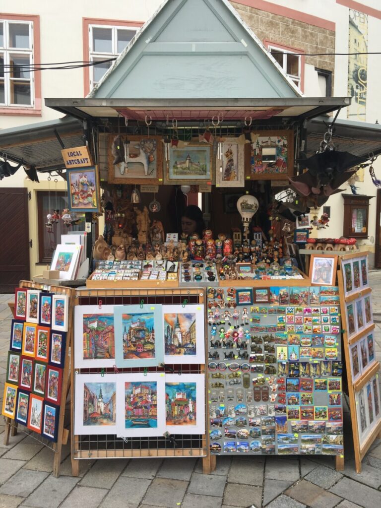 A small hexagon shaped wooden stand is an outlet for souvenir shopping in Bratislava.