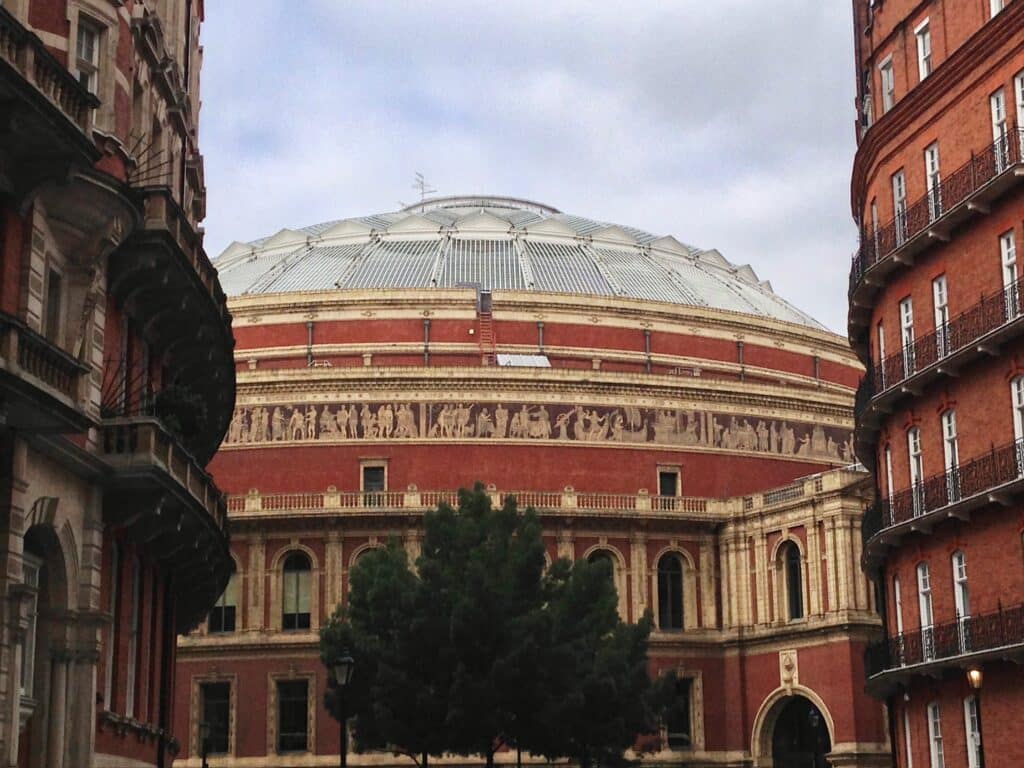 A brick brown building with a classic dome