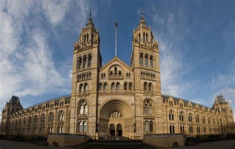 A large cathedral style building in London with twin towers on each side of the arched entrance. This is now the Natural History Museum.
