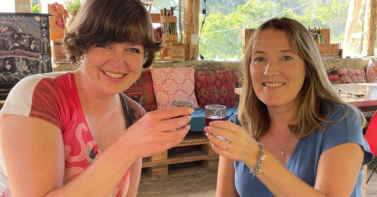 Two women toasting with Cha Cha, the national drink of Georgia.
