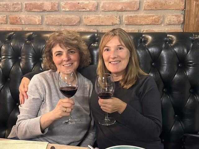 Two woman enjoying a glass of Georgian Red Wine