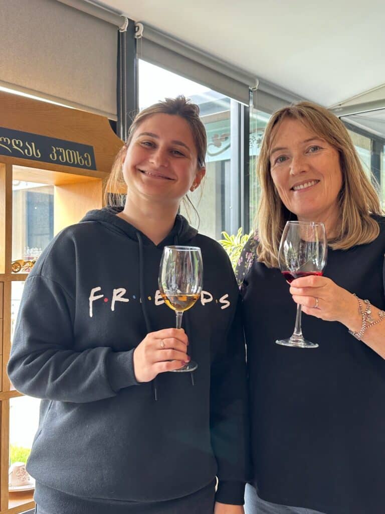 Tour guide and guest toasting with Georgian Red Wine.